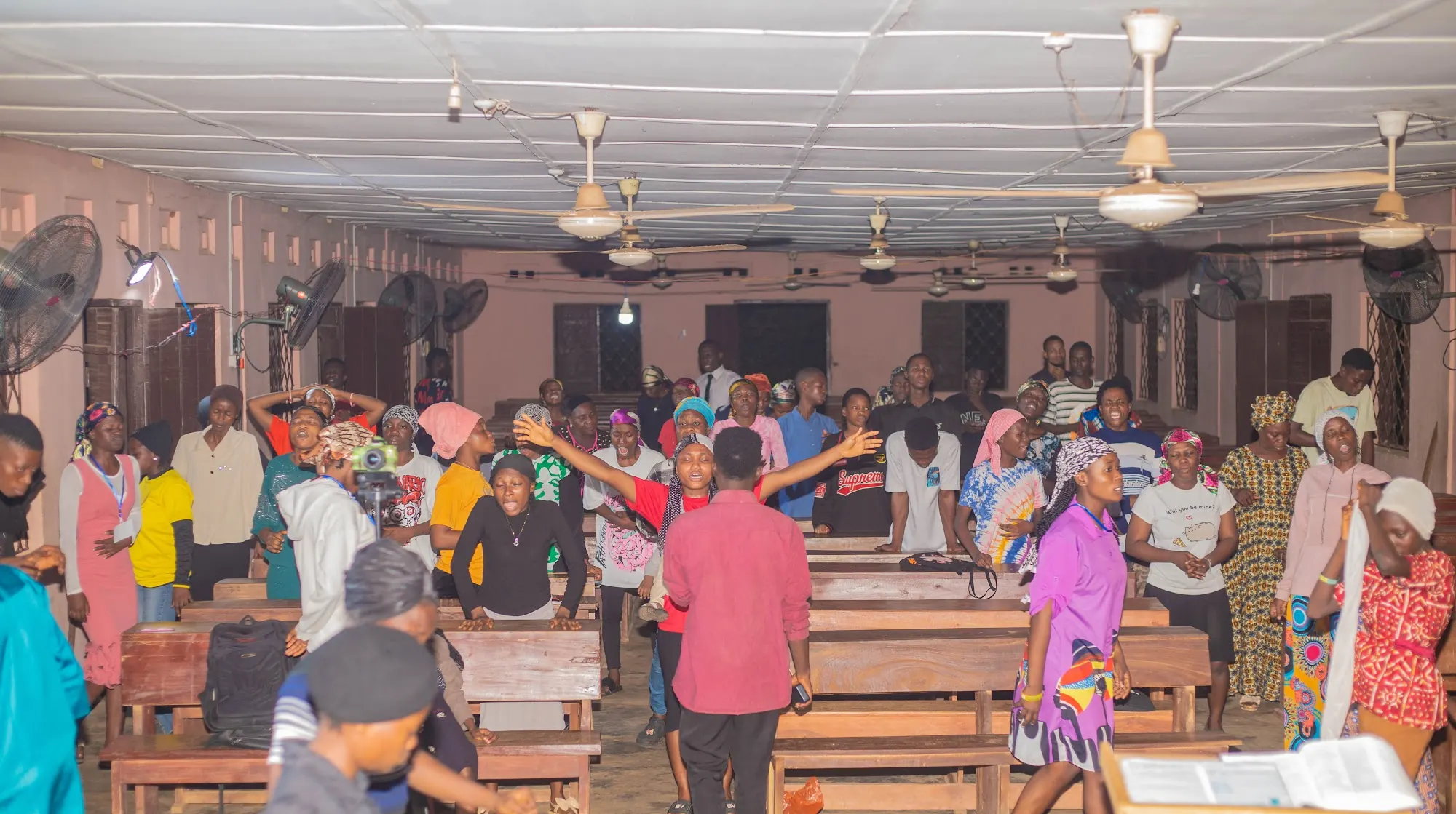Worshippers lifting their hands in praise during a service in Aiyepe, Ijebu