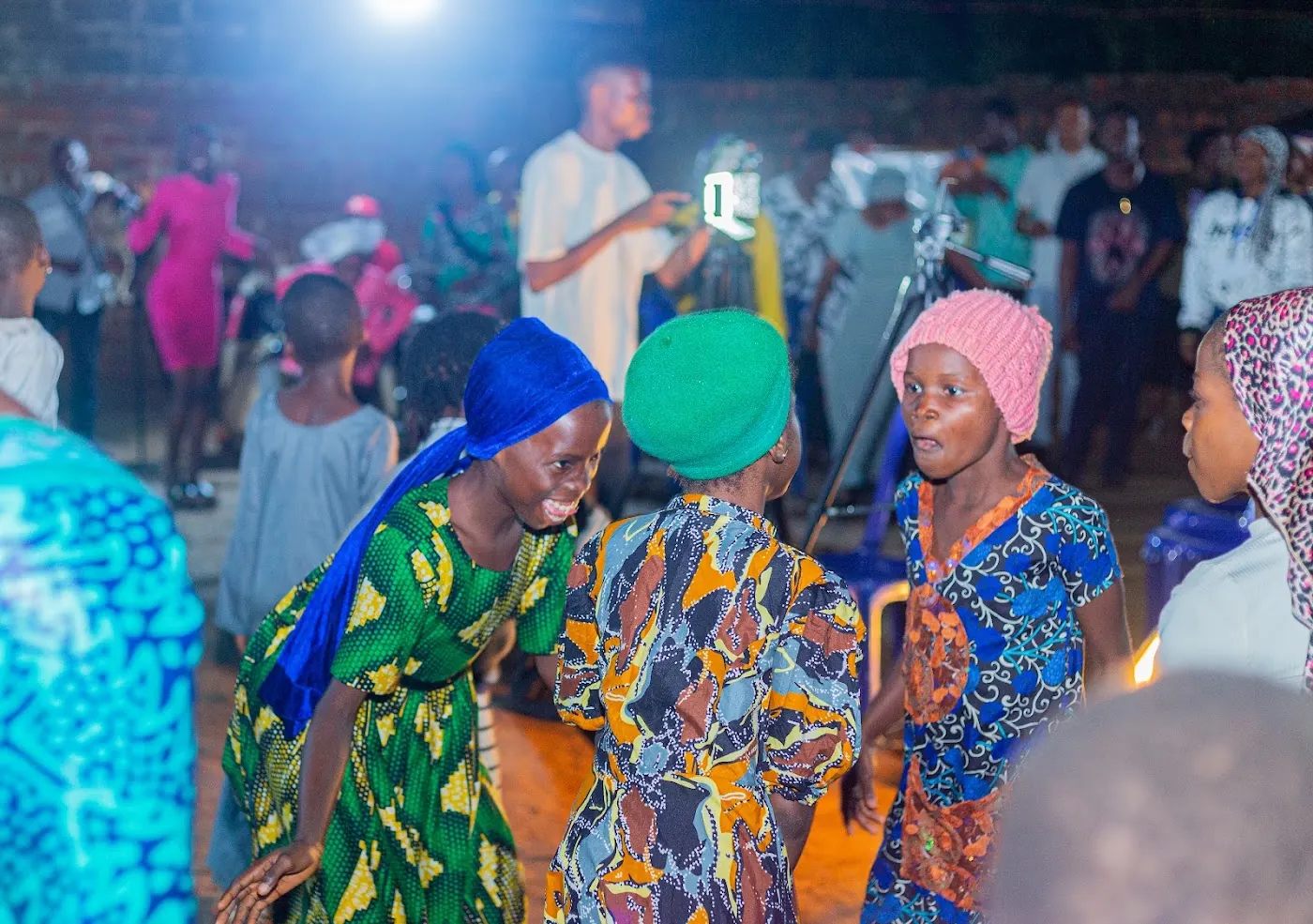 Believers worshipping together at night during a service in Aiyepe, Ijebu